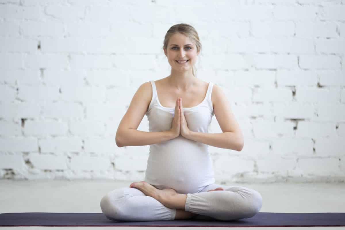 Duis sagitis ipsum prasent Pregnant Young Woman Sitting Prenatal Yoga Prayer Position 1